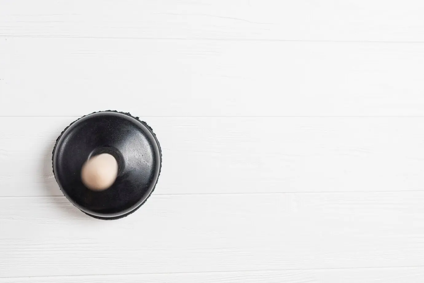 Force applied to the cup from above.